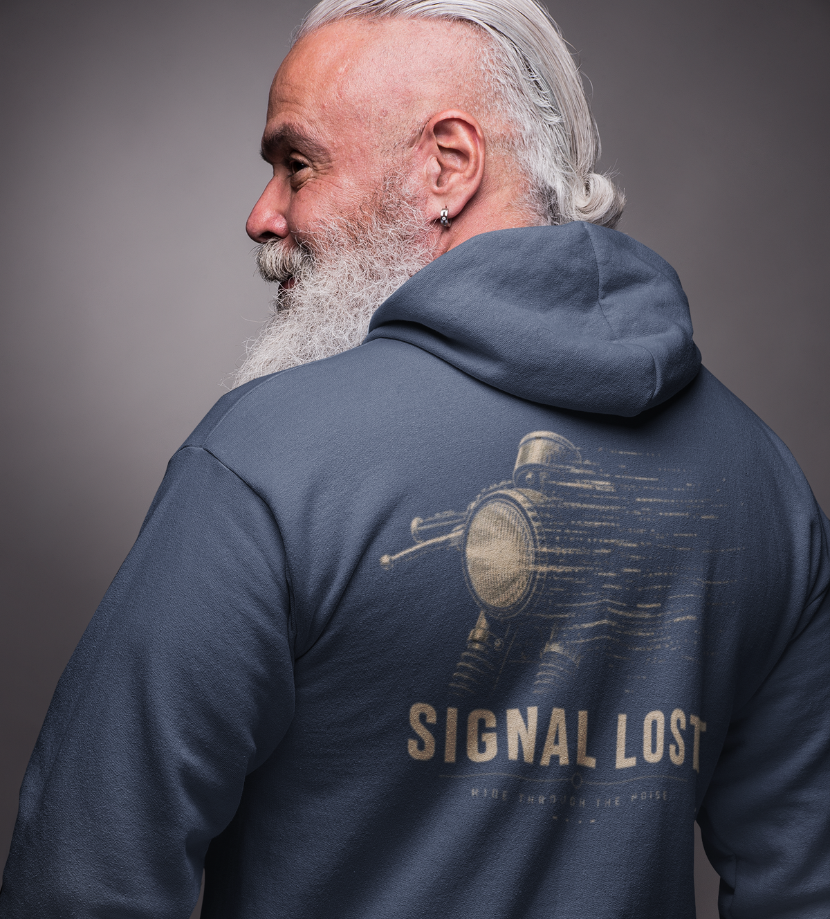 A man with a gray beard and hair is shown from the back wearing a navy blue hoodie with a vintage motorcycle graphic and the text 'SIGNAL LOST' printed on the back.